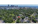 Aerial view of a residential neighborhood and city skyline. Red arrow indicating property location at 1119 Highland S St, St Petersburg, FL 33701