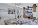 Bright living room features modern decor, stylish furniture, and a custom entertainment center at 1119 Highland S St, St Petersburg, FL 33701