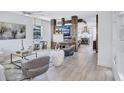 Inviting living room features a custom entertainment center and elegant decor open to kitchen at 1119 Highland S St, St Petersburg, FL 33701