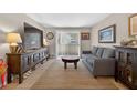 Bright living room featuring a modern entertainment center and cozy seating arrangement at 1400 Gandy N Blvd # 809, St Petersburg, FL 33702