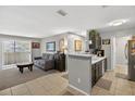 Inviting living space with an open floorplan flowing into a stylish kitchen area at 1400 Gandy N Blvd # 809, St Petersburg, FL 33702