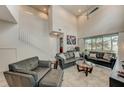 Beautiful living room featuring tile flooring, high ceilings, and comfortable furniture at 1976 Marlington Way, Clearwater, FL 33763