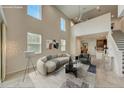 Open-concept living room with abundant natural light, high ceilings, and views of the kitchen at 1976 Marlington Way, Clearwater, FL 33763