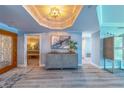 Welcoming foyer showcasing elegant decor, wood floors, and an open view to the bedroom at 2 Seaside Ln # 801, Belleair, FL 33756