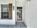 Close-up of the front entrance of a home, showing address and decorative tile at 2937 Stilwell Ct, New Port Richey, FL 34655