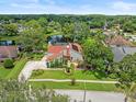 Beautiful home with pond views surrounded by mature trees in a lush community at 4118 Carrollwood Village Dr, Tampa, FL 33618