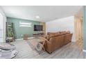 Cozy living room with modern furniture and decor, featuring stylish flooring and a comfortable seating area at 4518 Ashmore Dr, Tampa, FL 33610
