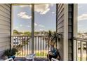 Screened-in lanai with views of the marina and water, perfect for relaxing outdoors at 5722 Biscayne Ct # 107, New Port Richey, FL 34652
