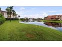 Picturesque pond with fountain surrounded by lush green spaces adding a touch of tranquility at 6 Academy S Way # 221, St Petersburg, FL 33711