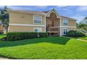 Comfortable condo complex with manicured lawn, mature shrubs, and inviting facade at 9481 Highland Oak Dr # 806, Tampa, FL 33647