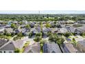 A peaceful community with a variety of home styles, tree-lined streets, and lush green spaces at 11539 Tangle Branch Ln, Gibsonton, FL 33534