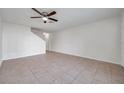 Inviting living room featuring neutral walls, tile flooring, and a staircase, perfect for relaxation and entertainment at 1302 Twilridge Pl, Brandon, FL 33511