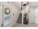 Inviting entryway with neutral tones, tiled floor and a staircase at 1508 S Howard Ave # A, Tampa, FL 33606