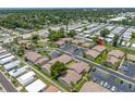 Aerial view of the Coastal Ridge community highlighting the building's parking and tree coverage at 2131 Ridge S Rd # 19, Largo, FL 33778