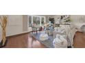 Bright living room with hardwood floors, neutral colors, and large bay window at 2174 Kent Ave, Clearwater, FL 33764