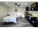 Functional bedroom equipped with a kitchenette, providing comfort and convenience at 2509 Thornbrook Pl, Tampa, FL 33618