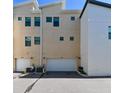 Rear garages and driveway, illustrating ease of access and parking at 2568 13Th N Ave # 2568, St Petersburg, FL 33713