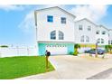 Attractive two-story home boasting a spacious driveway, two-car garage, and vibrant curb appeal at 5253 Boardwalk St, Holiday, FL 34690
