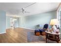 The living room features wood-look flooring and a ceiling fan at 6000 20Th N St # 123, St Petersburg, FL 33714