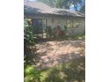 Cozy backyard with a brick patio and lush tropical plants at 6262 142 N Ave # 1001, Clearwater, FL 33760