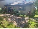 Private backyard featuring a brick-paved patio surrounded by greenery at 6262 142 N Ave # 1001, Clearwater, FL 33760