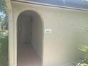 Inviting entrance with tiled floor and archway, showing property number for easy identification at 6262 142 N Ave # 1001, Clearwater, FL 33760