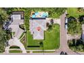 An aerial view of a charming home with a pool, spa and lush landscaping at 8200 31St N Ter, St Petersburg, FL 33710
