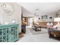Spacious living room with tile flooring, a comfortable brown sofa, and modern decor at 11116 118Th St, Seminole, FL 33778