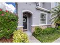 Close-up of welcoming front door with decorative wreath and stone accents at 2020 Greenwood Valley Dr, Plant City, FL 33563