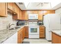 Well-maintained kitchen features stainless steel appliances, granite countertops, and ample cabinet space at 2700 Bayshore Blvd # 6210, Dunedin, FL 34698