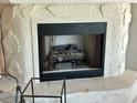 Stone fireplace with decorative logs, perfect for cozy evenings and adding charm to the home at 3811 Huntington Ne St, St Petersburg, FL 33703