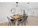 Elegant dining room featuring modern lighting and a stylish table setting, perfect for entertaining guests at 105 12Th Sw St, Ruskin, FL 33570