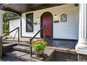 Beautiful craftsman home with a welcoming red front door and a lovely porch at 1217 E 29Th Ave, Tampa, FL 33605
