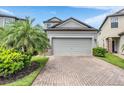 Charming two-story home with brick driveway and well-maintained landscaping at 1634 Acadia Harbor Pl, Brandon, FL 33511