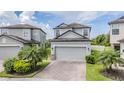 Charming two-story home with brick driveway and well-maintained landscaping at 1634 Acadia Harbor Pl, Brandon, FL 33511