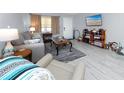Cozy living room featuring tile flooring and comfortable seating arrangements at 211 Pasadena N Ave # 109, St Petersburg, FL 33710