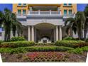 Grand entrance with columns, manicured greenery, and colorful flowers for a welcoming appeal at 345 Bayshore Blvd # 1510, Tampa, FL 33606