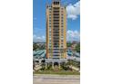 Towering yellow condo building with balconies, framed by landscaped grounds and city views at 345 Bayshore Blvd # 1510, Tampa, FL 33606