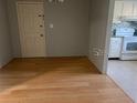 Dining room with hardwood floors and a view into the kitchen area with modern appliances at 3535 41St S Ter # 219, St Petersburg, FL 33701