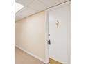 Hallway view featuring front door with gold knocker and security lock at 400 64Th Ave # 202, St Pete Beach, FL 33706