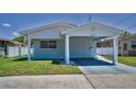 Charming single-story home with a covered parking area and well-maintained landscaping at 4849 Floramar Ter, New Port Richey, FL 34652