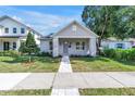 Beautiful craftsman-style home featuring a well-maintained lawn and cozy front porch at 5124 3Rd N Ave, St Petersburg, FL 33710
