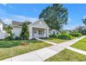 Charming home with a neatly kept lawn and inviting walkway to the front door at 5124 3Rd N Ave, St Petersburg, FL 33710