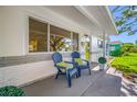 Inviting front porch features comfortable seating and manicured greenery at 6219 Hampton N Dr, St Petersburg, FL 33710