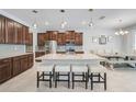 Modern kitchen featuring granite countertops, stainless steel appliances, and a large center island with seating at 8305 Praise Dr, Tampa, FL 33625
