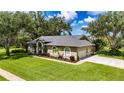 Attractive home with a spacious front lawn and a two-car garage at 8901 Eagle Watch Dr, Riverview, FL 33578
