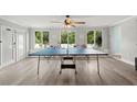 Bright game room featuring a ping pong table, and natural light at 14030 79Th Ave, Seminole, FL 33776