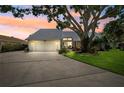 Charming single-story home featuring a metal roof, well-maintained landscaping, and a spacious driveway at 1531 75Th Ne Cir, St Petersburg, FL 33702