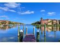 Scenic waterfront view featuring calm blue waters and luxury condo buildings, great for boating at 2733 Via Cipriani # 830B, Clearwater, FL 33764