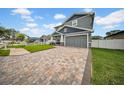 Attractive two-story house with a lovely brick driveway and neatly trimmed landscaping, creating a welcoming exterior at 3013 W Crest Ave, Tampa, FL 33614